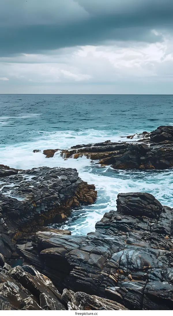 Rocky Coastline With Ocean Waves Crashing On The Rocks