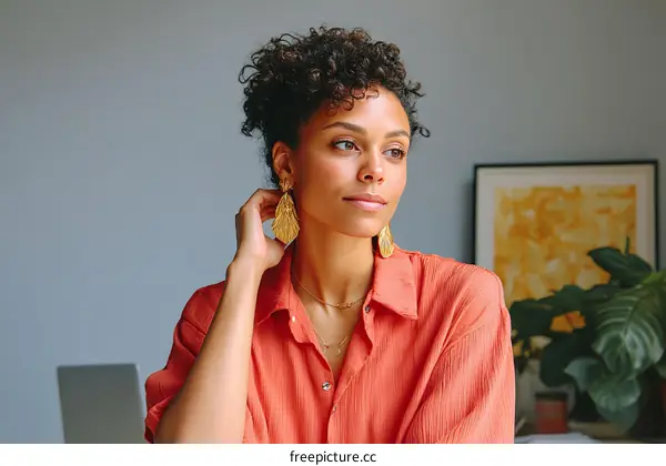Thoughtful Woman in Coral Shirt
