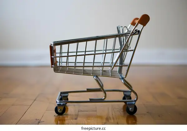 Miniature Shopping Cart on Wooden Floor
