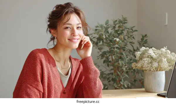 Smiling Asian Woman in a Cozy Cardigan