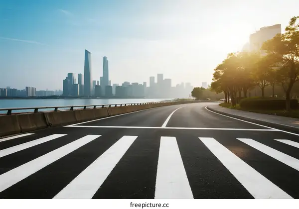 Urban road with city skyline and clear sky in the background