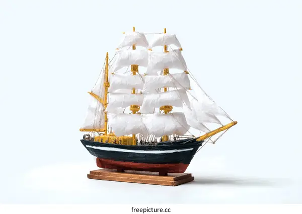 Detailed Wooden Model Sailing Ship on White Background