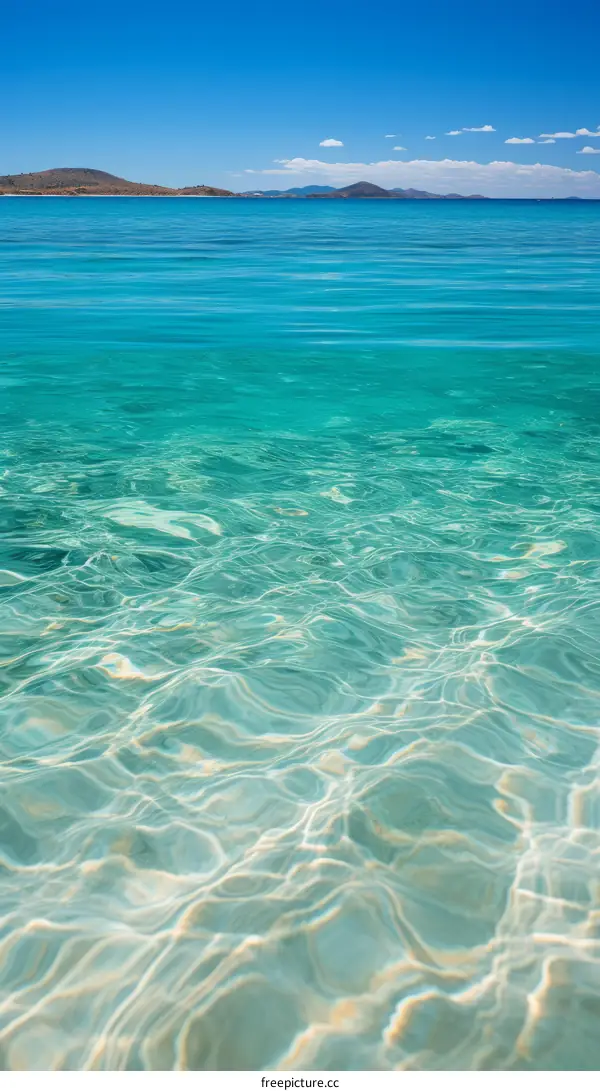 Crystal clear water with island in the distance