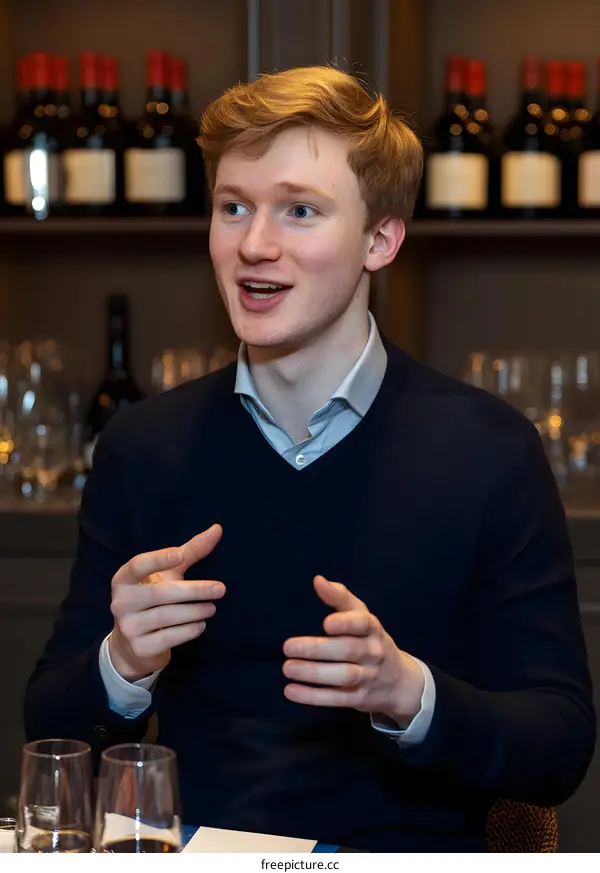 Young Man Speaking at a Wine Tasting Event