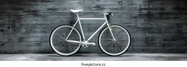 Modern White Bicycle Against a Concrete Wall