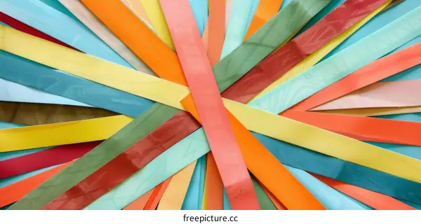 Colorful Paper Strips Arranged in a Starburst Pattern