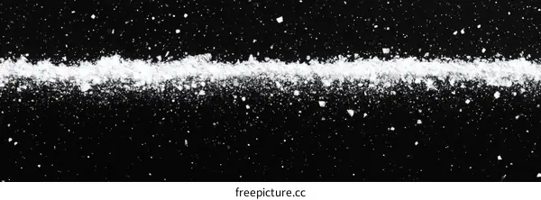 Abstract White Powder on Black Background