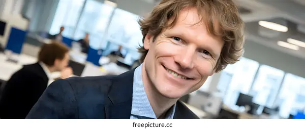 Portrait of a Smiling Businessman in an Office Setting