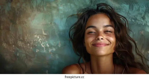 portrait of a smiling young woman with freckles