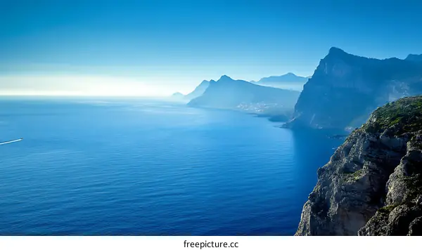 Vast Ocean Meets Majestic Mountains