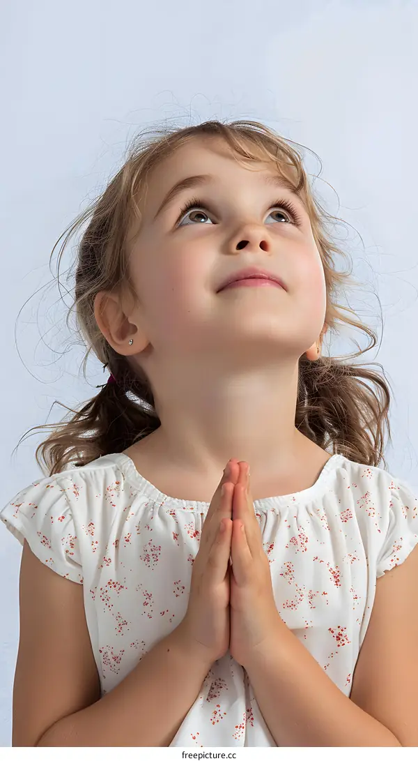 Little Girl Praying With Hands Together
