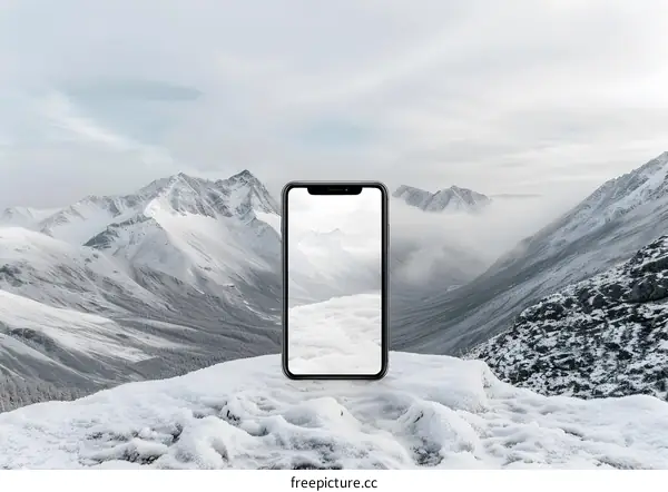 Smartphone on a snowy mountain peak