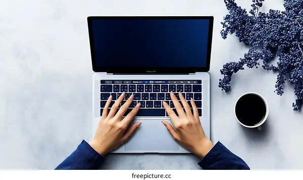 Woman working on laptop top view