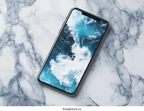 Smartphone With Ocean Waves Wallpaper On Marble Surface