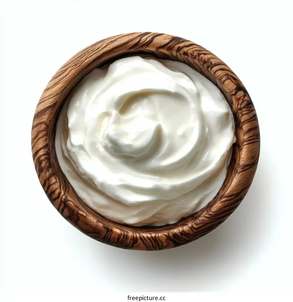 Wooden Bowl Filled With Creamy Yogurt