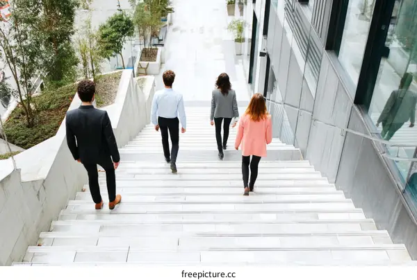 Business People Walking Up Stairs in City