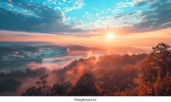 Scenic View of Mountain Range With Fog and Sunrise