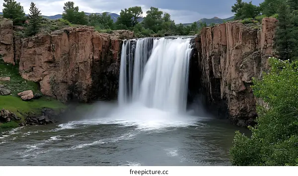 Majestic Waterfall Cascading Down Rocky Cliffs
