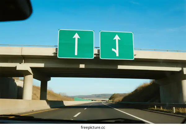 Highway sign indicating directions for different lanes