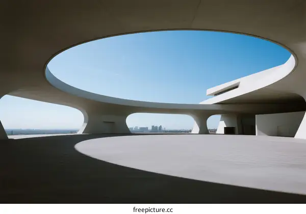 Modern Architectural Structure with Curved White Roof and Open Spaces