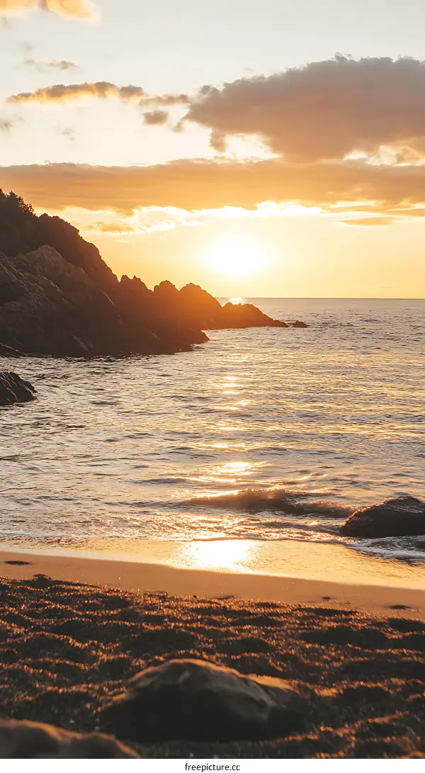 Golden Hour Sunset Over the Ocean and Rocky Coastline