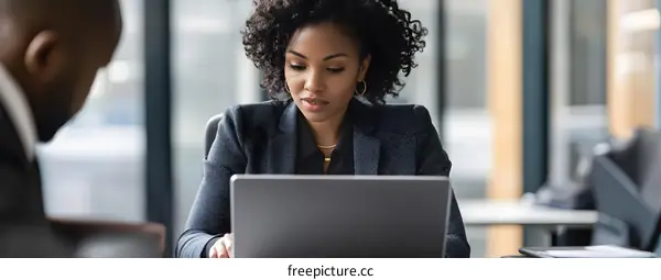 African American Businesswoman Working On Laptop