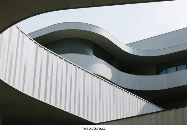 Modern Architectural Structure with Curved Lines and Metal Surfaces