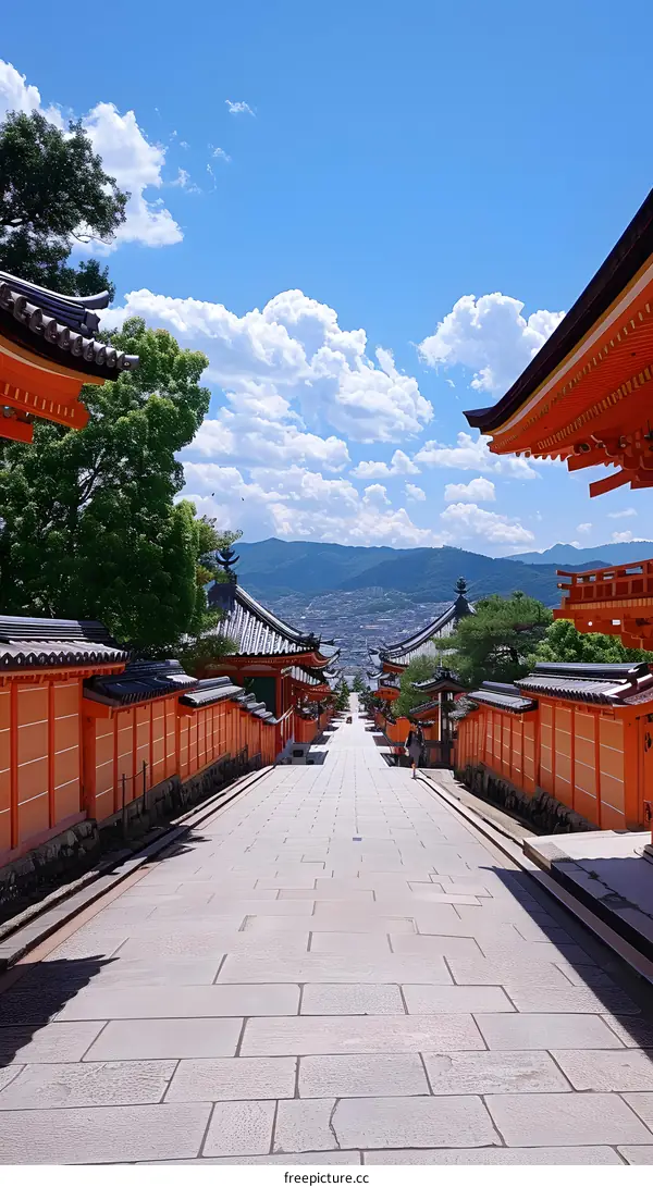 Stone Pathway Leading Up To a Japanese Temple With Orange Walls