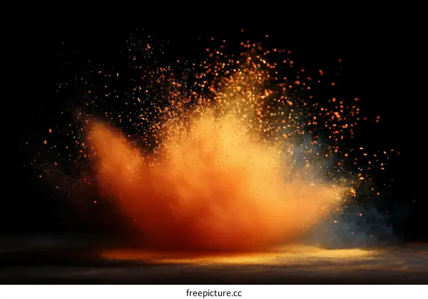 Explosion of Orange Powder on Black Background