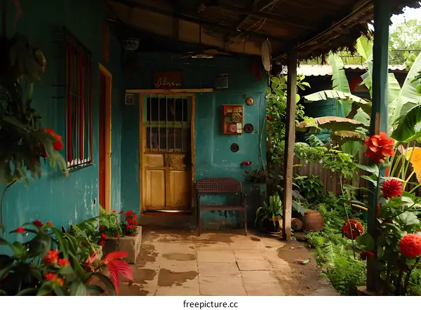 Tropical Green Porch with Yellow Door and Flowers