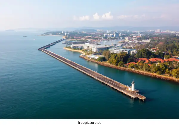 Coastal Cityscape with Pier and Lighthouse