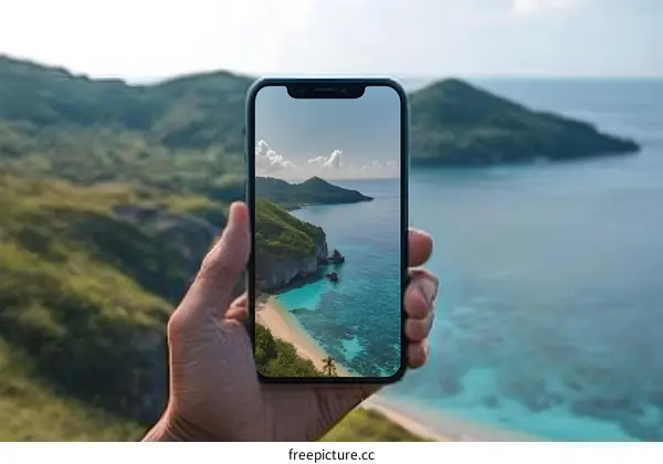 Hand Holding Phone with Tropical Beach Landscape