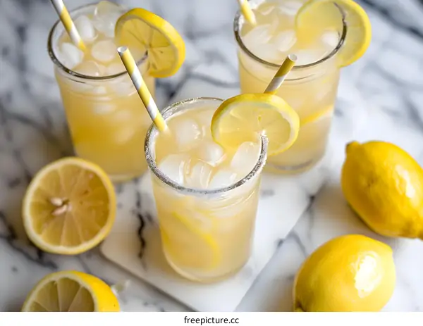 Lemonade with Lemon Slices and Ice Cubes in Glass Tumbler