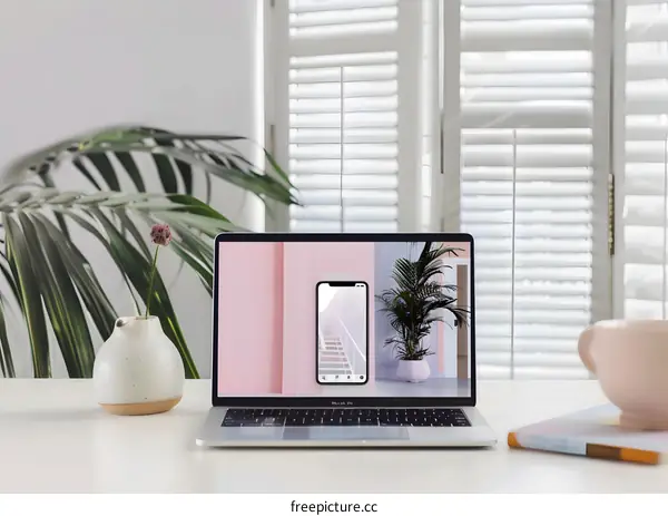 Laptop with Screen Showing Pink Interior Design with Stairs