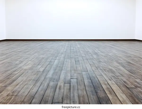 Empty Room with Wooden Floor and White Wall