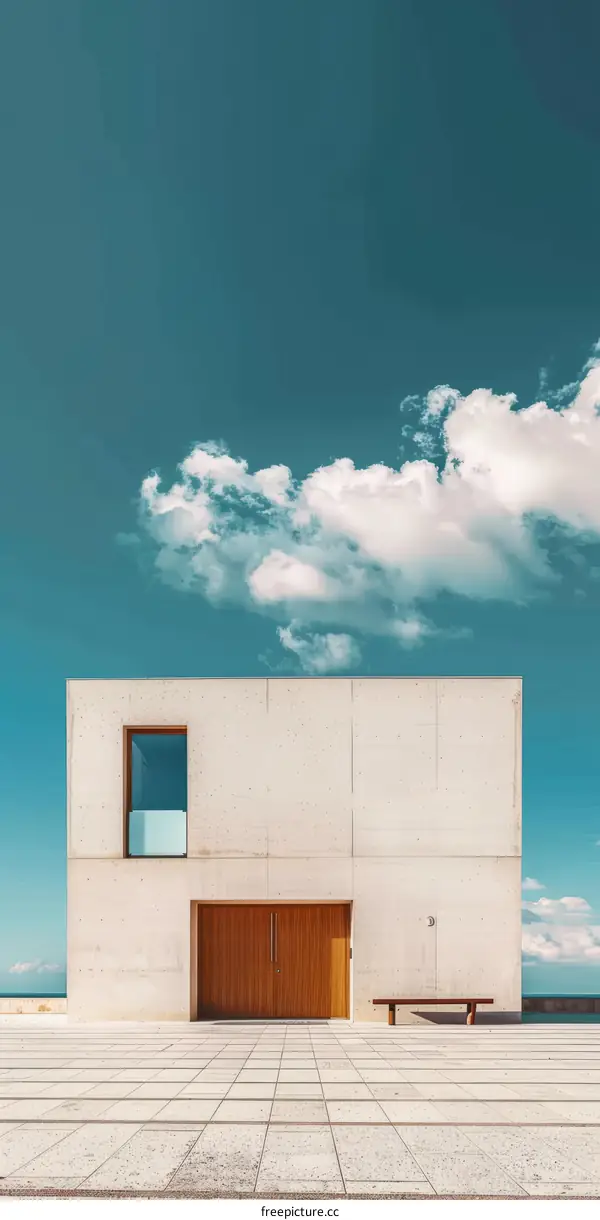 Small modern house with blue sky and clouds