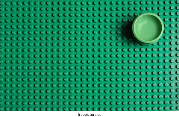 Green Building Blocks Background with Small Bowl