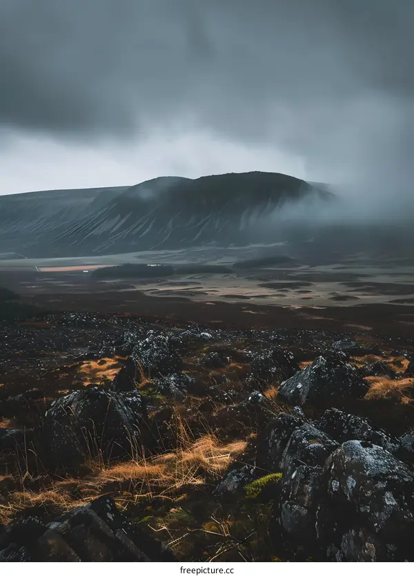 Moody Mountain Landscape with Dark Clouds and Rocks