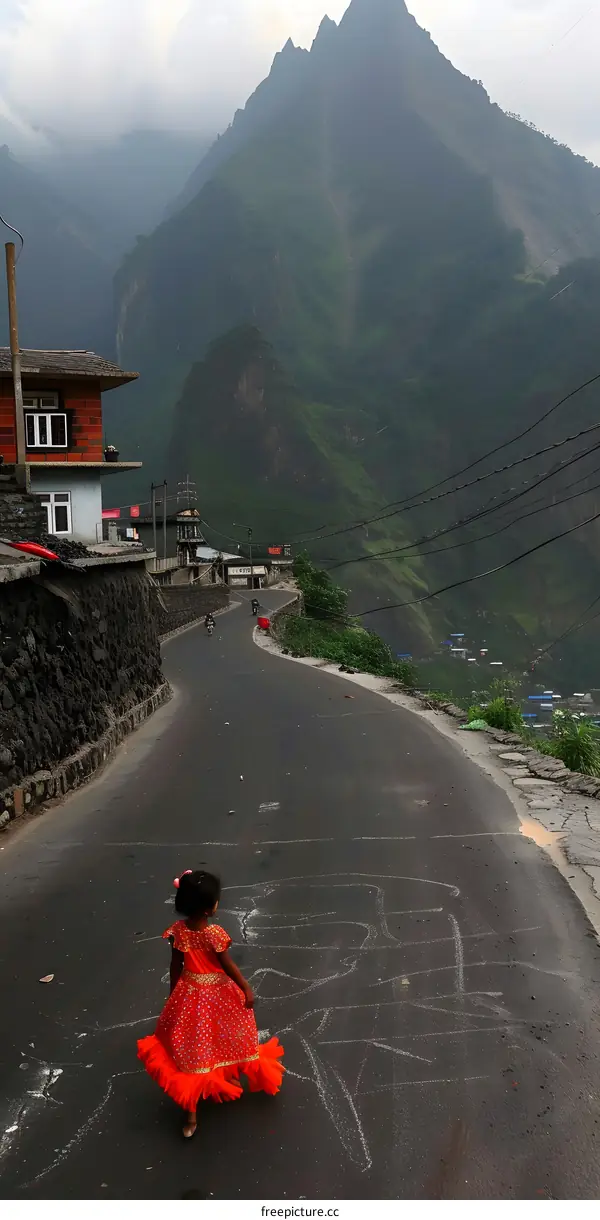 Girl in Red Dress Walking on Road with Mountain View