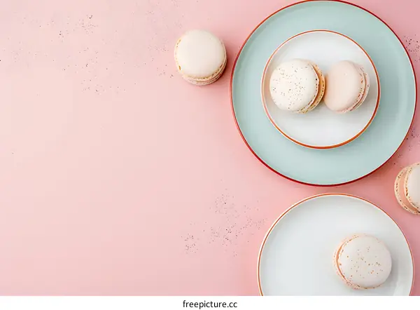 Pink Background With Plates And Macarons