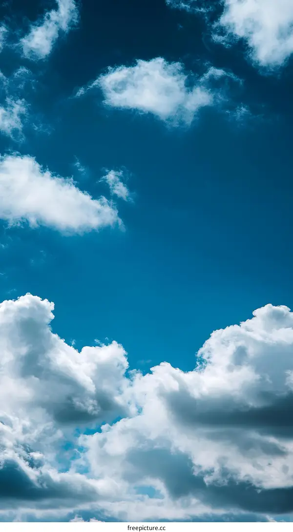 Blue Sky With White Fluffy Clouds