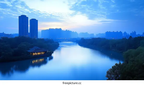 Cityscape at Dawn Over the River