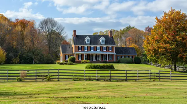 Brick Farmhouse in Autumn Landscape