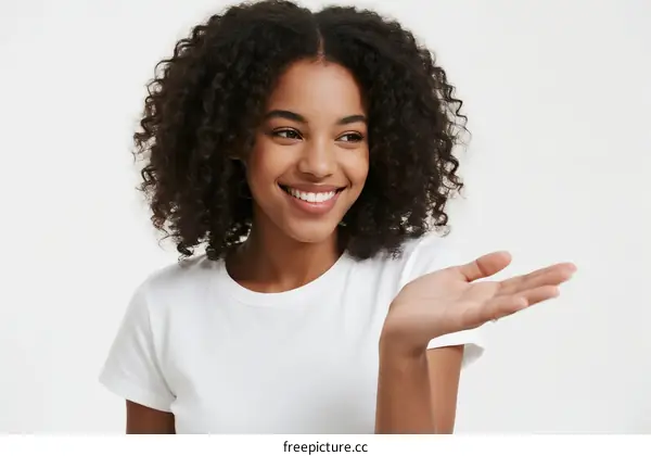 Young African American Woman with Curly Hair Gesturing with Hand
