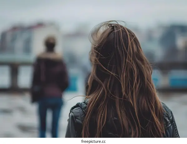 Woman with Long Brown Hair Walking Away From the Camera