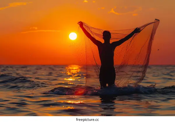 Fisherman alone in the middle of the ocean with his fishing net