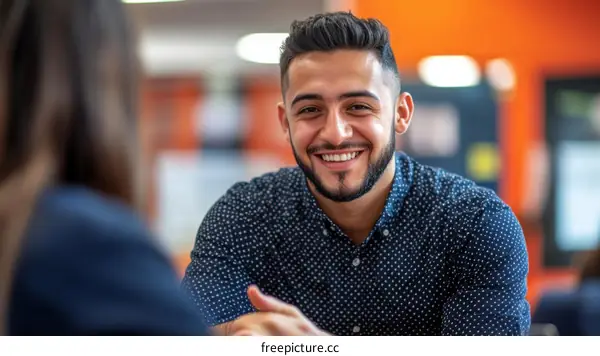 Smiling Young Man in Conversation