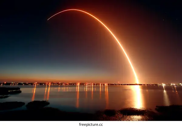 Rocket Launch Over Water at Night
