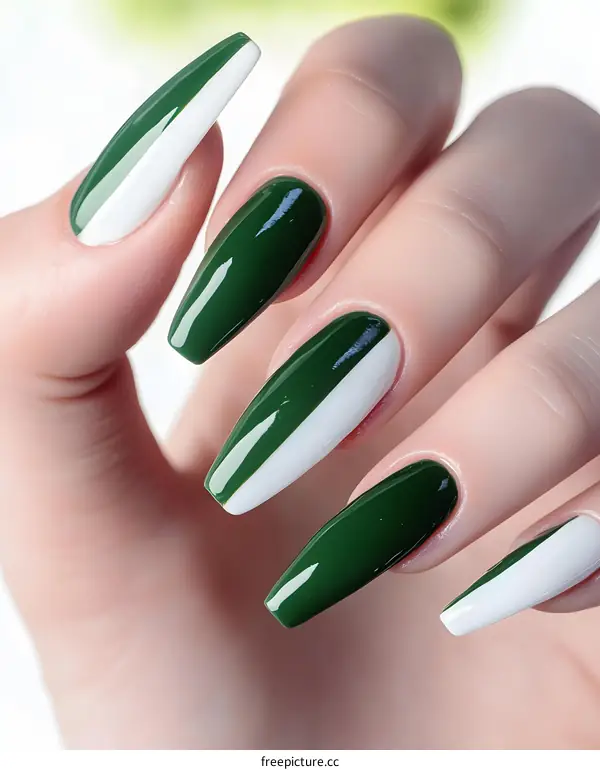 Closeup of Female Hand with Green and White Nail Polish