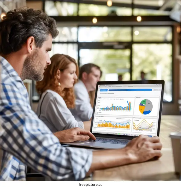 Business people working on laptop in cafe